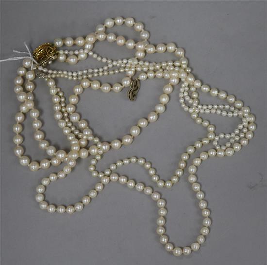 Four assorted cultured pearl necklaces including double strand with 9ct gold clasp.